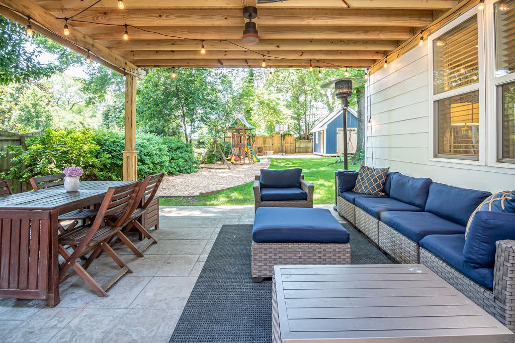 Blue Couch Near the Brown Wooden Table